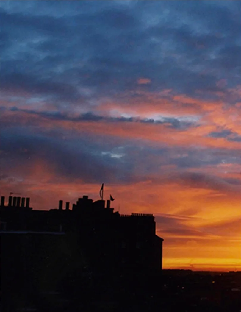 photography A sunset behind an old building in Edinburgh Scotland